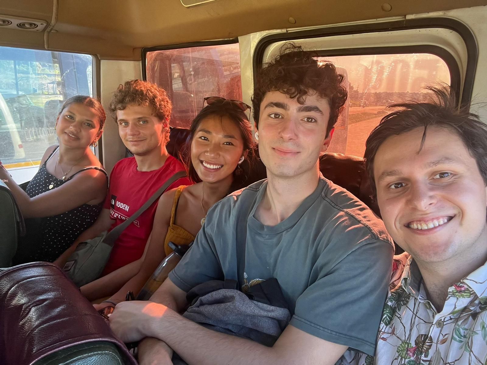 GML summer fellows on a bus in Tanzania